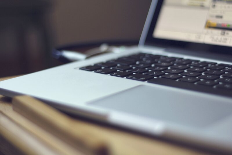 laptop on wooden surface