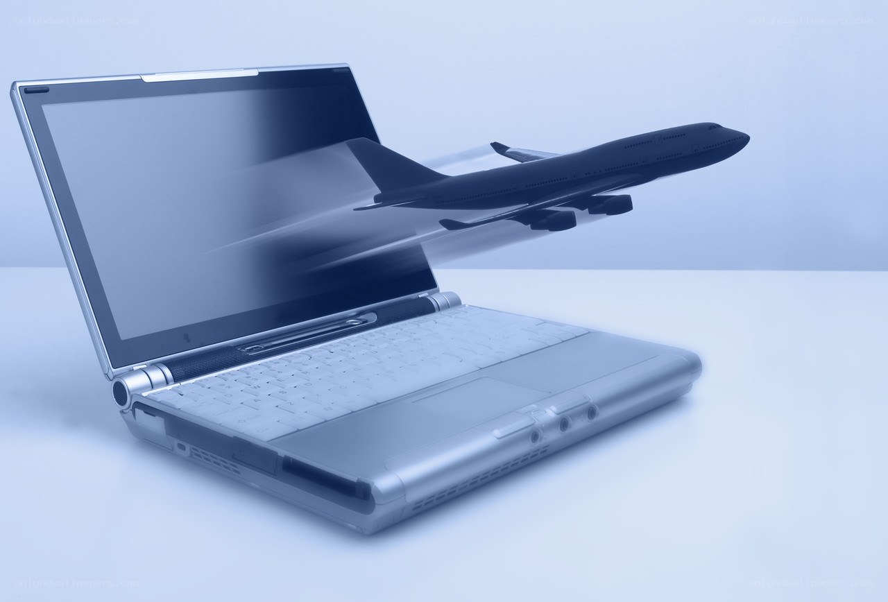 laptop with airplane model