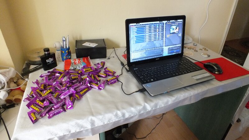 laptop with candy on table