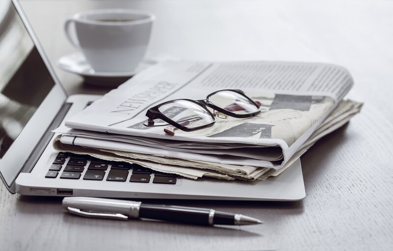 Laptop with Newspaper