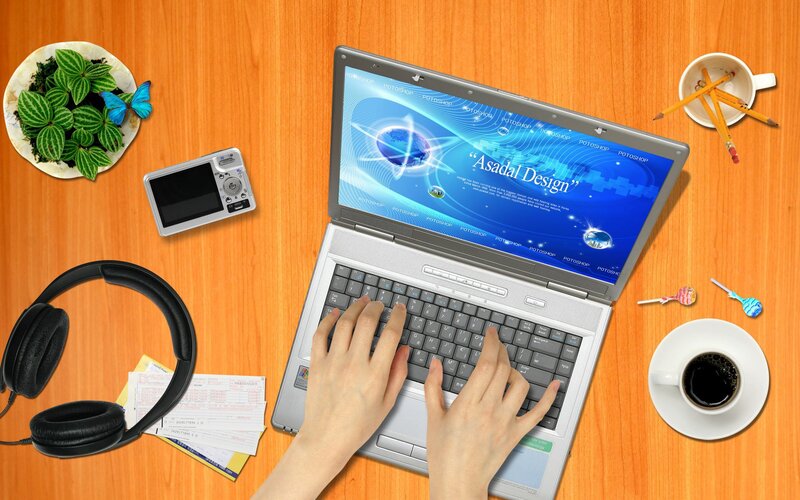 laptop workspace with design software
