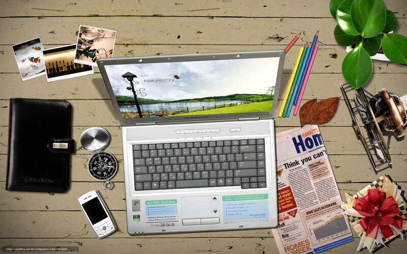 laptop workspace with supplies