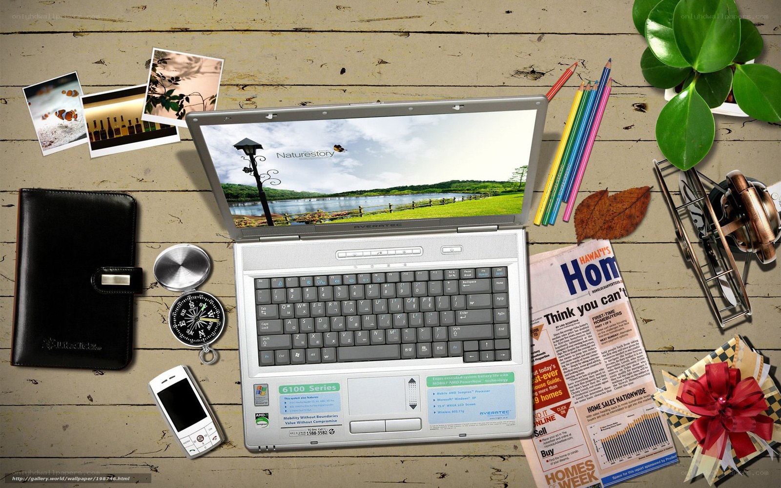 laptop workspace with supplies