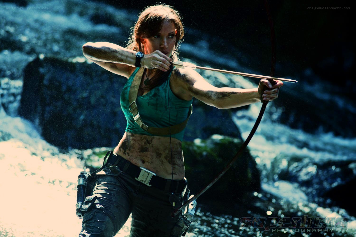 Lara Croft aiming bow in jungle