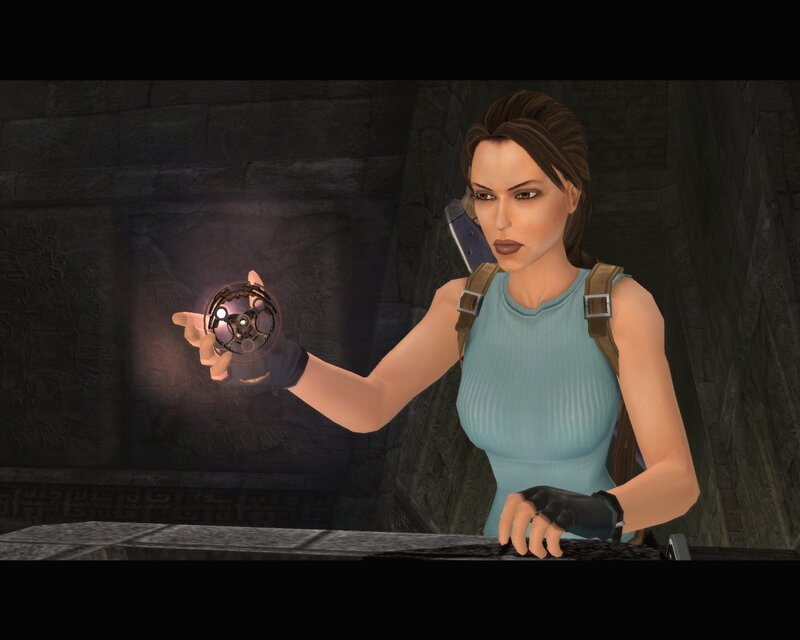 Lara Croft holding artifact