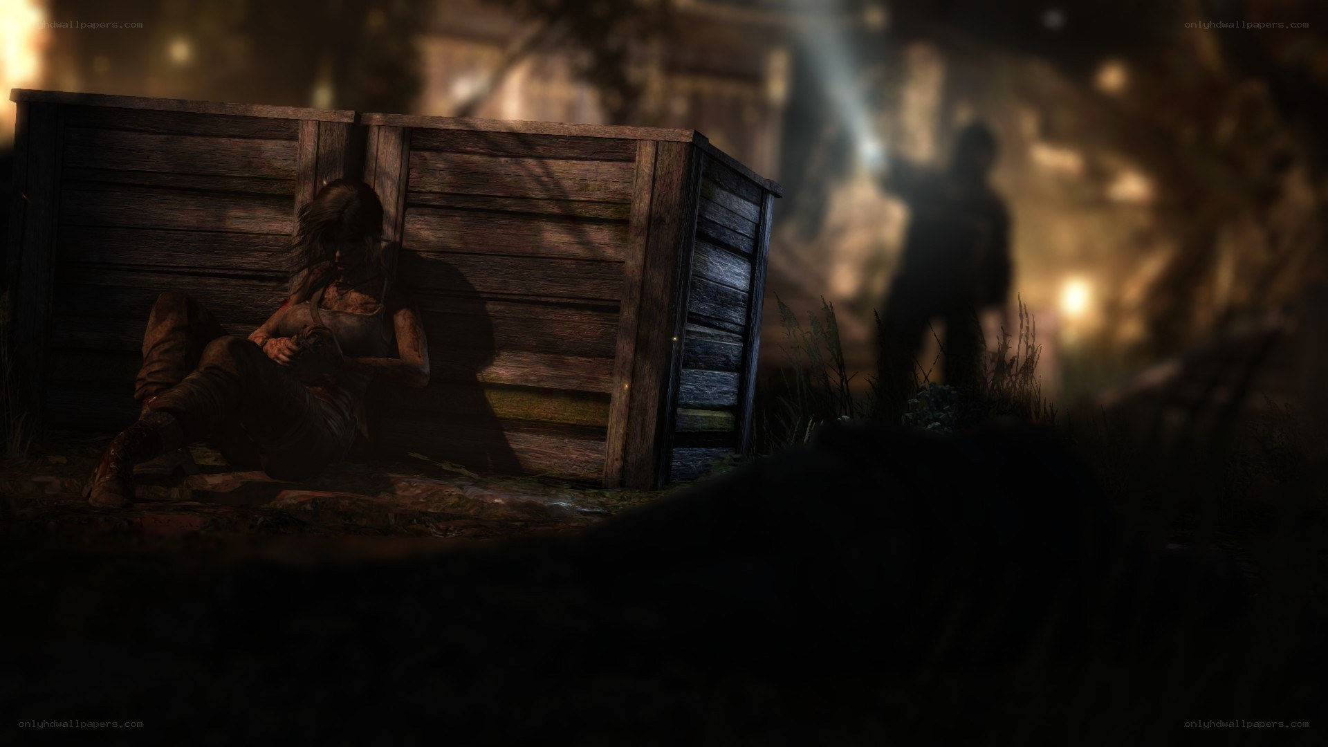 Lara Croft in a dark hideout