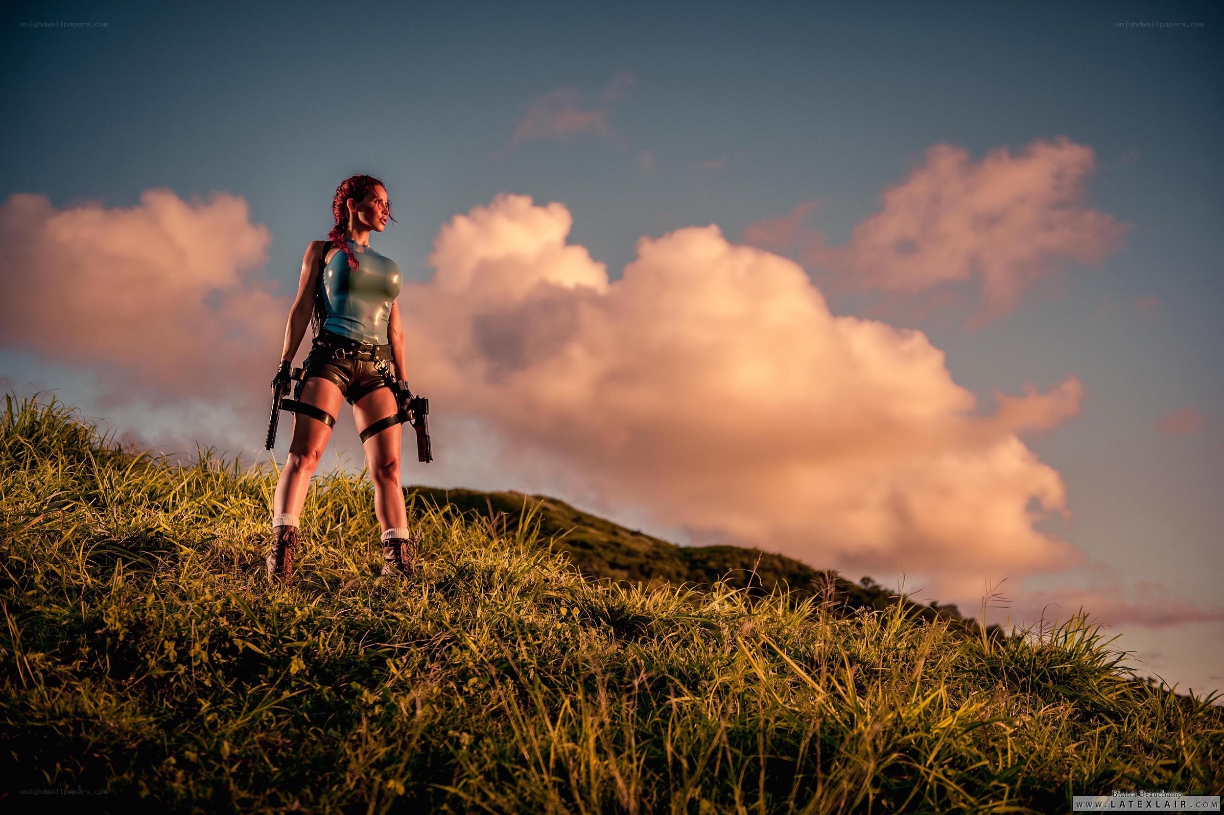 Lara Croft on a grassy hill