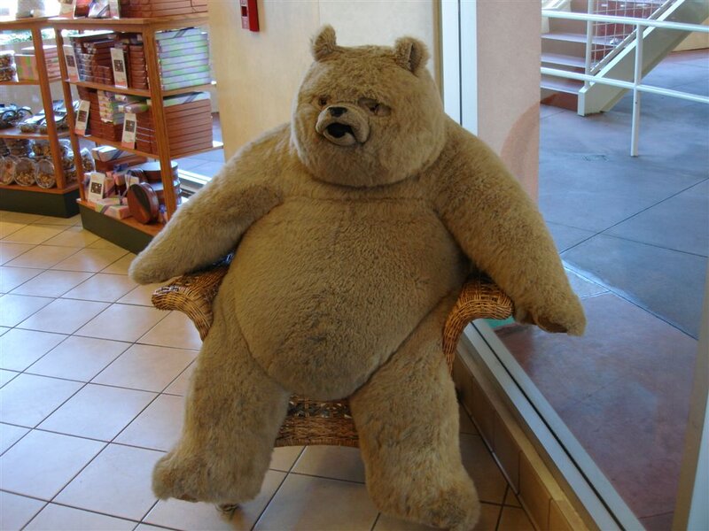 large bear statue in chair