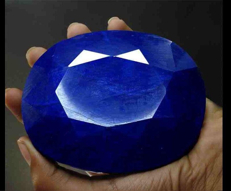 Large blue gemstone in hand