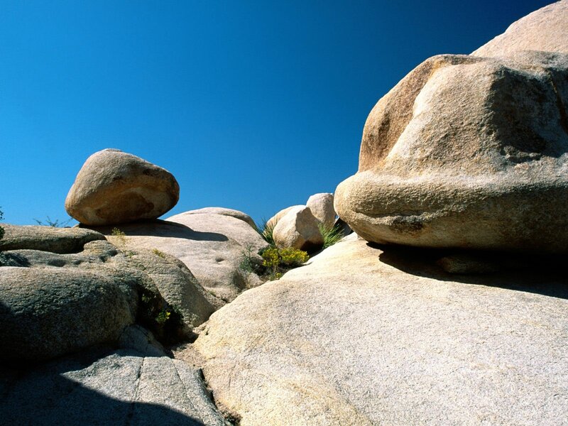 Large boulders under blue sky