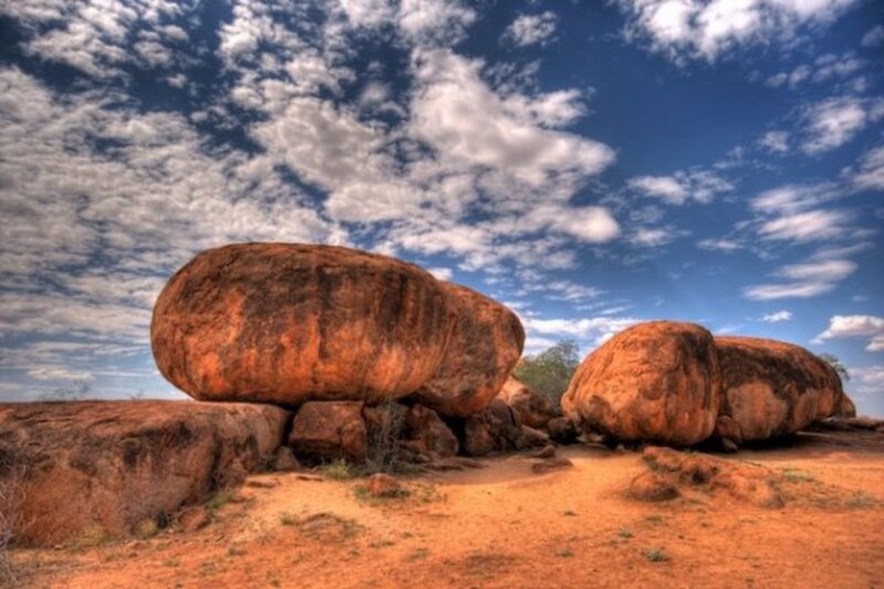 Large boulders under cloudy sky
