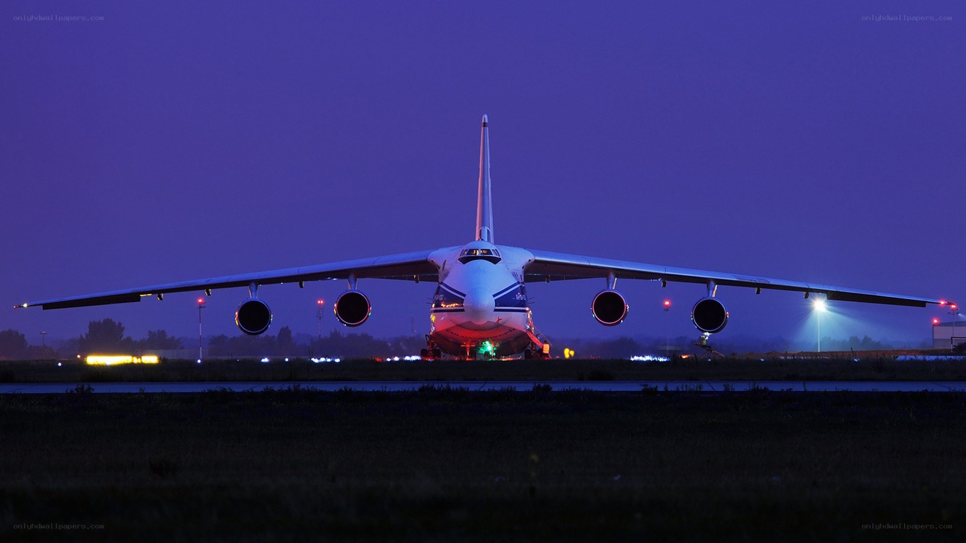 Large cargo plane on runway at night