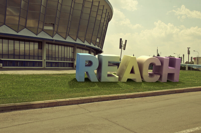 Large colorful letters spelling REACH