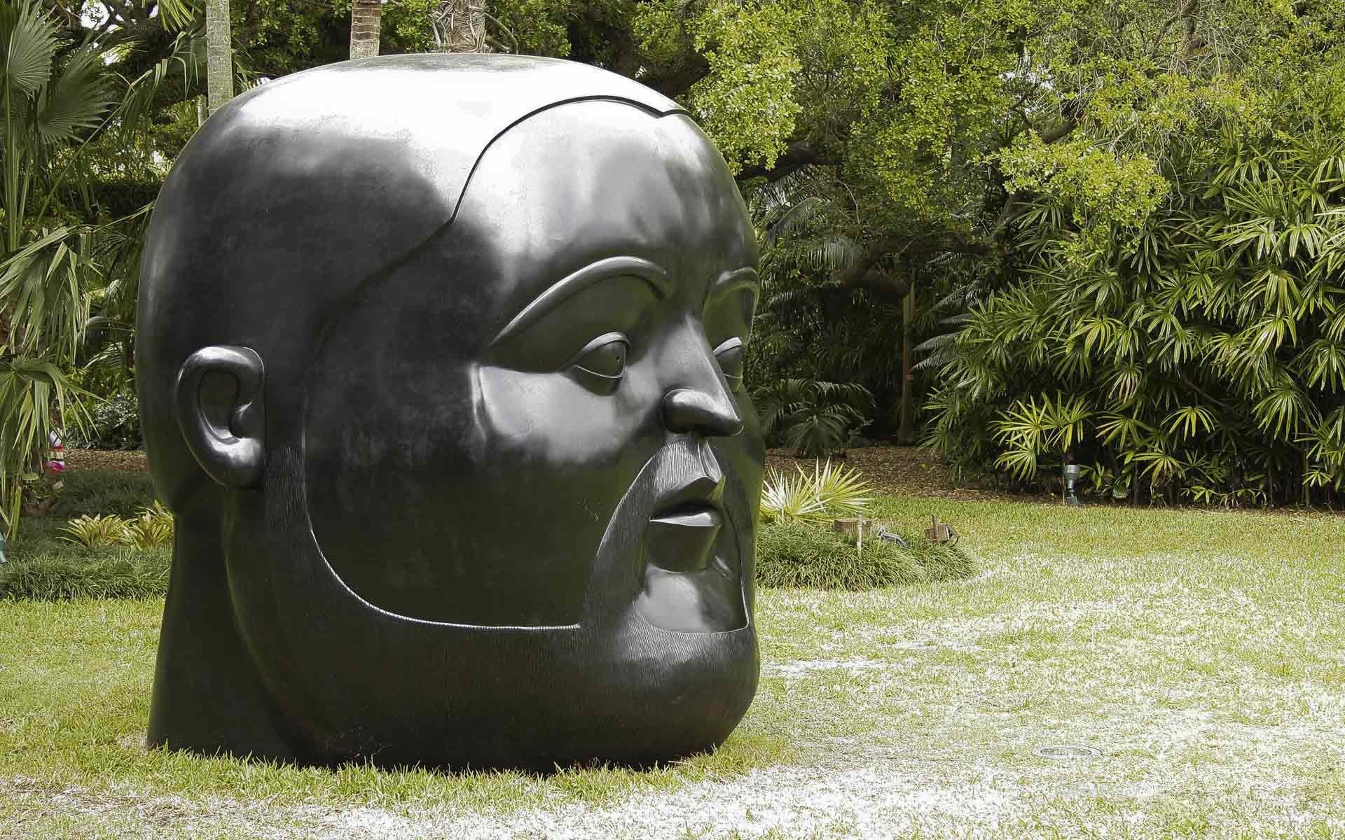 Large head sculpture in garden