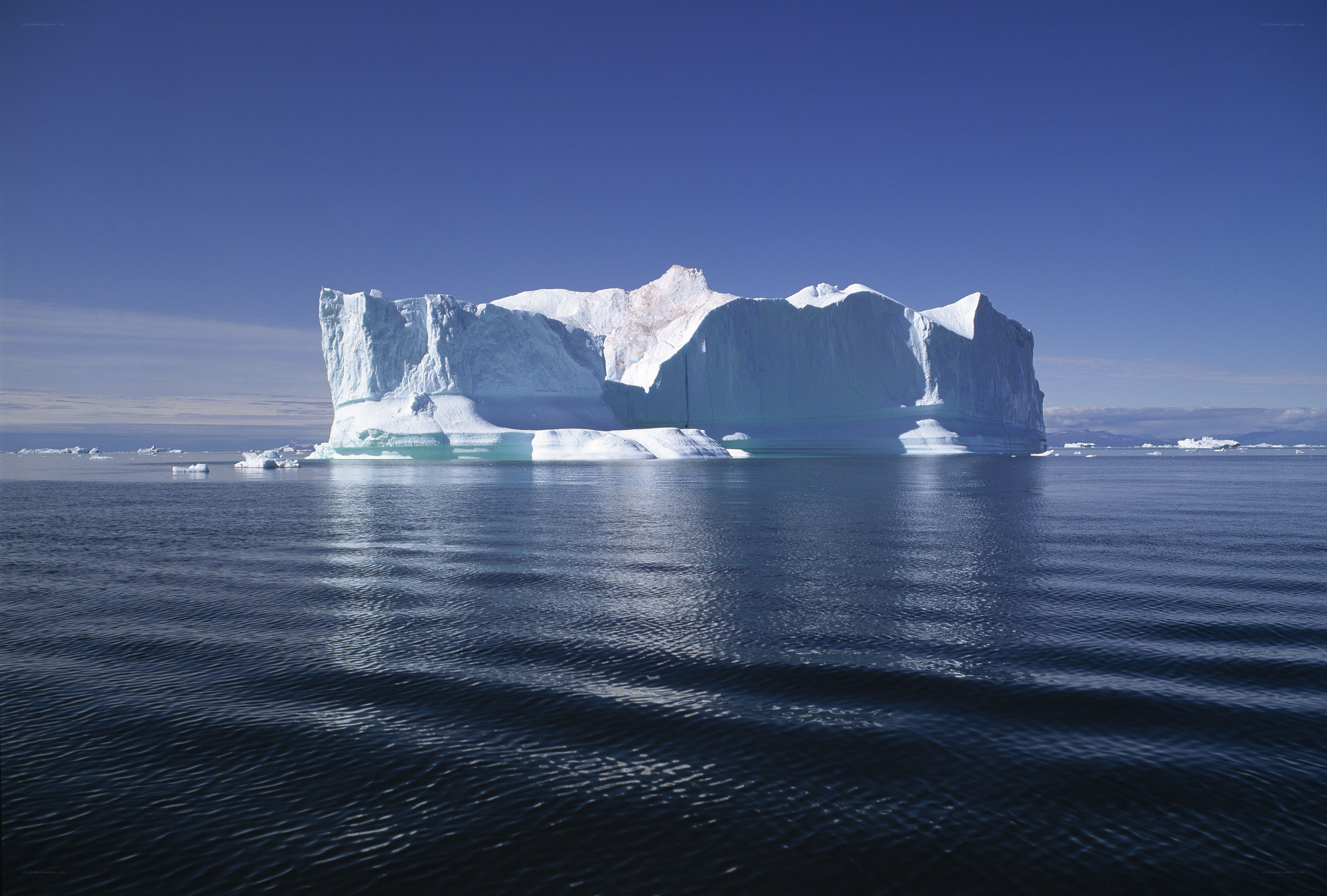 Large iceberg floating in calm sea