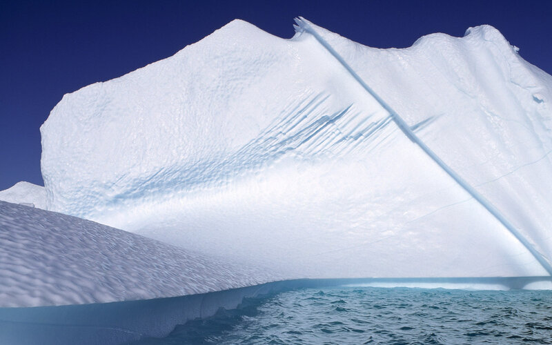 Large iceberg floating in ocean
