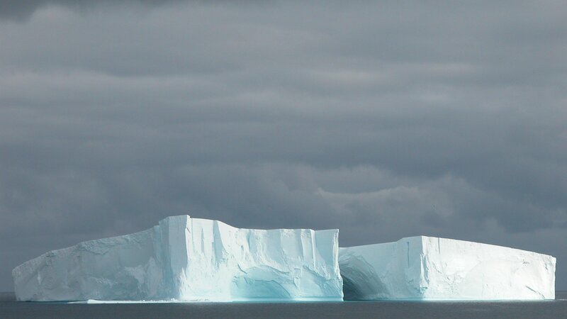 Large iceberg floating in ocean