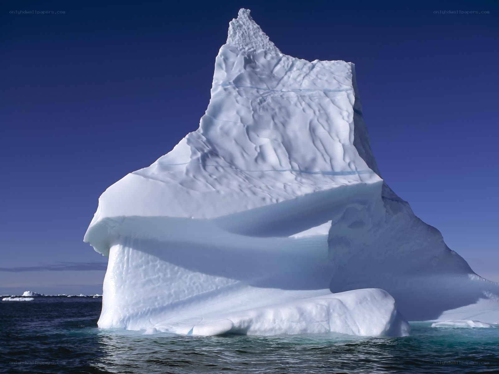 Large iceberg in blue water