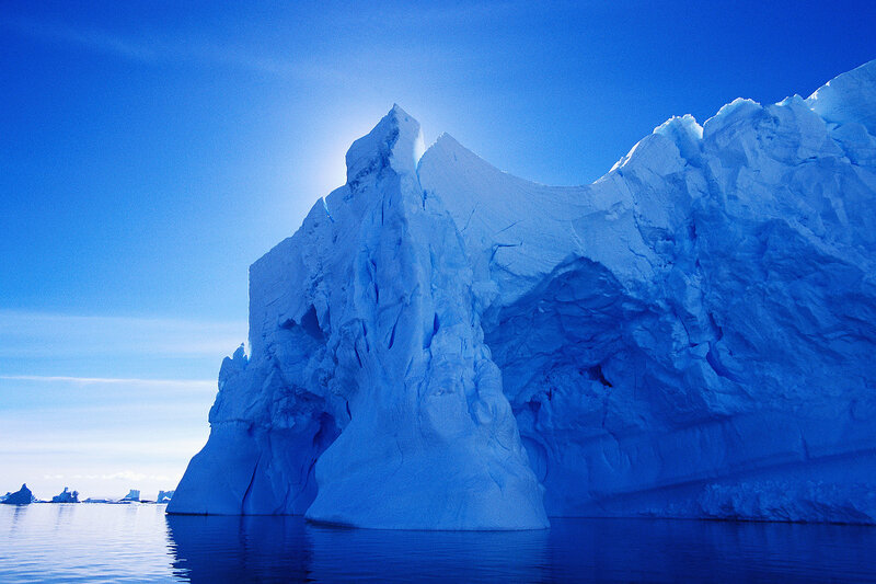 Large iceberg in blue water