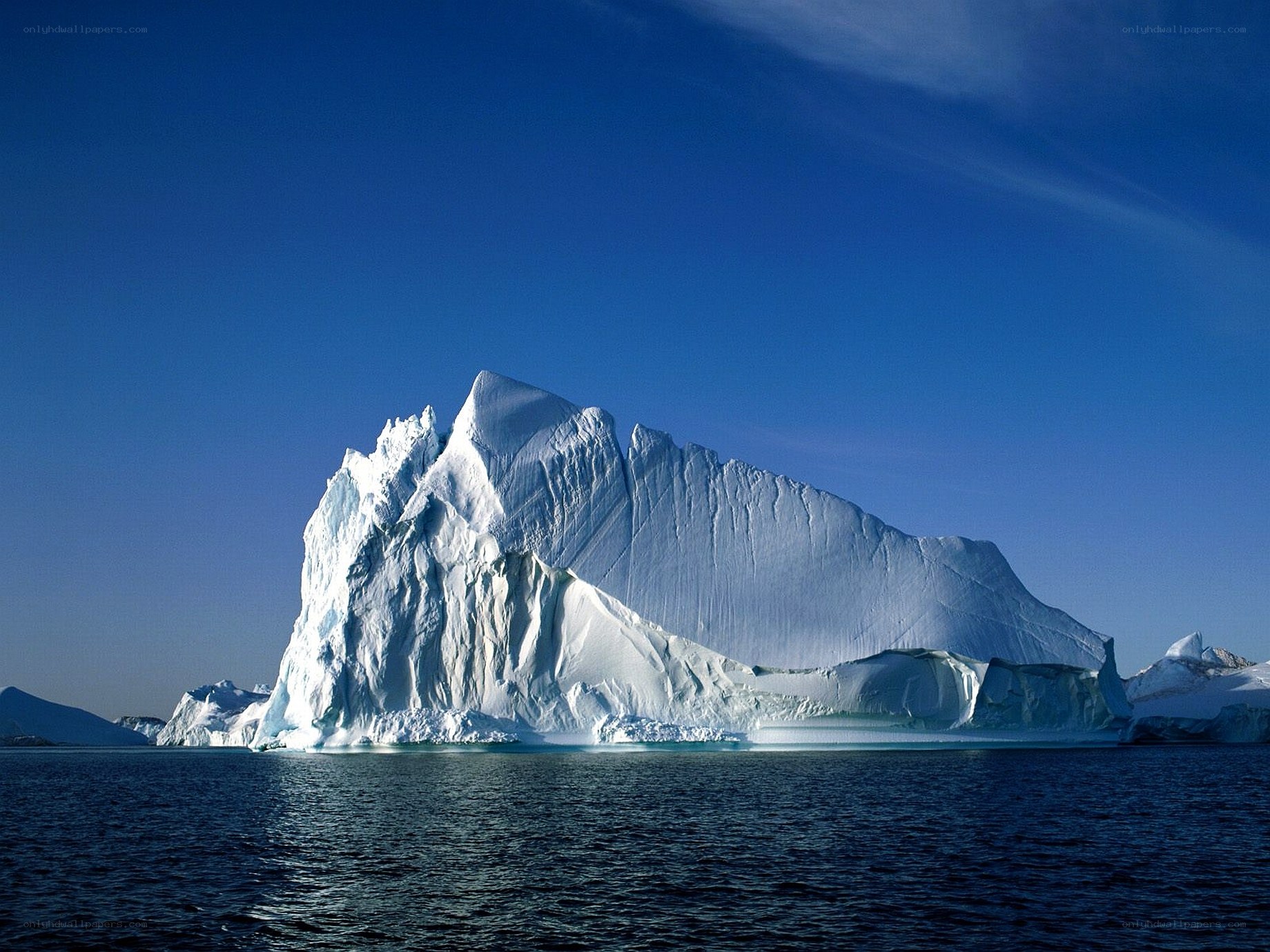 Large iceberg in blue water