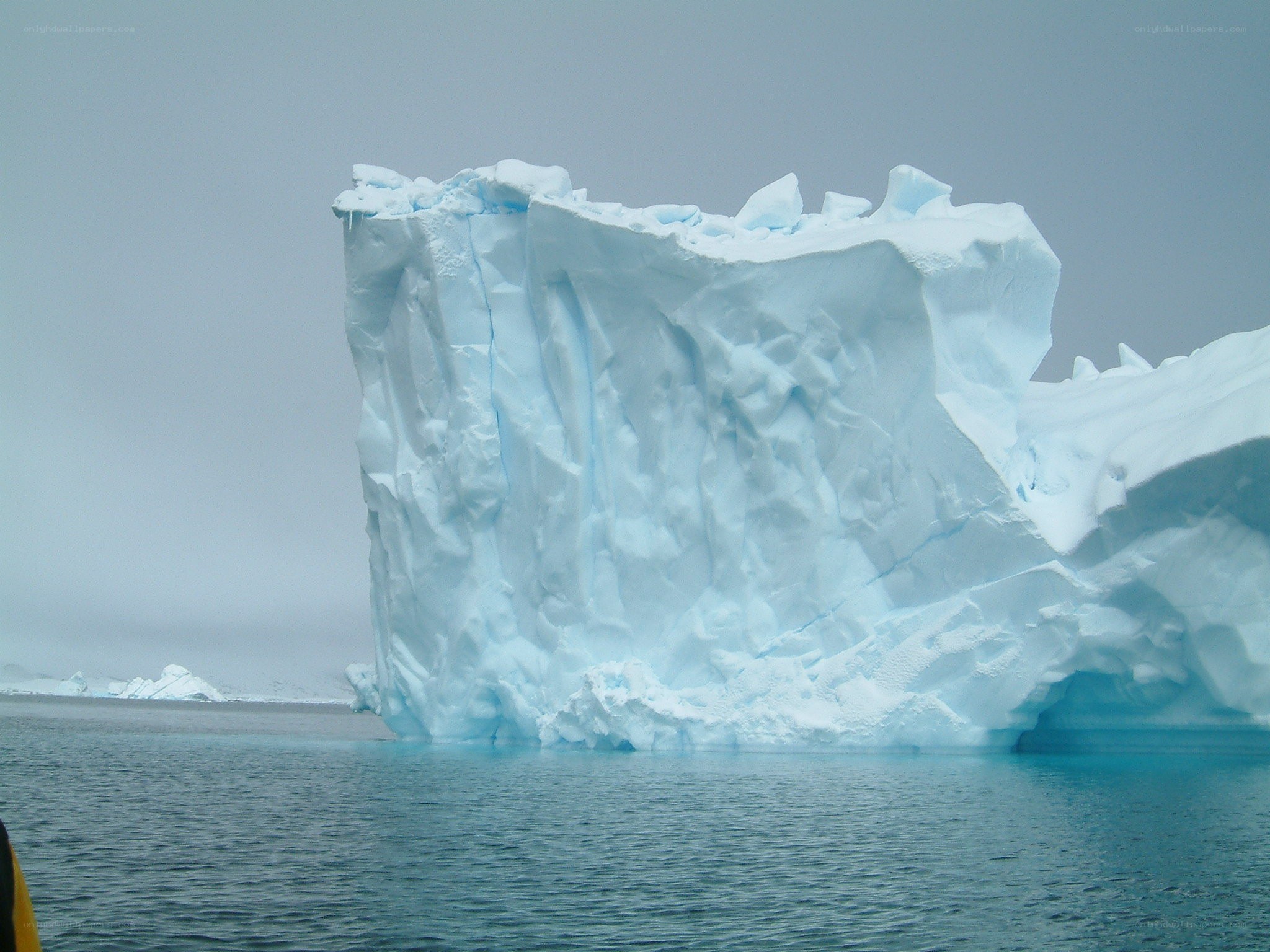 Large iceberg in calm water