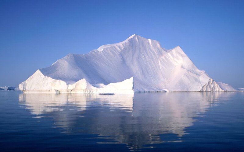Large iceberg in calm water