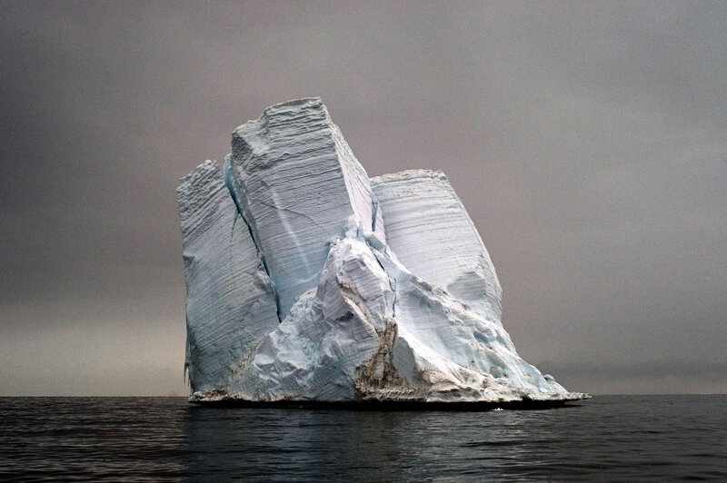 Large iceberg in calm waters