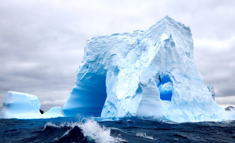 Large Iceberg in Ocean — Blue, Dramatic, Photograph, Clouds