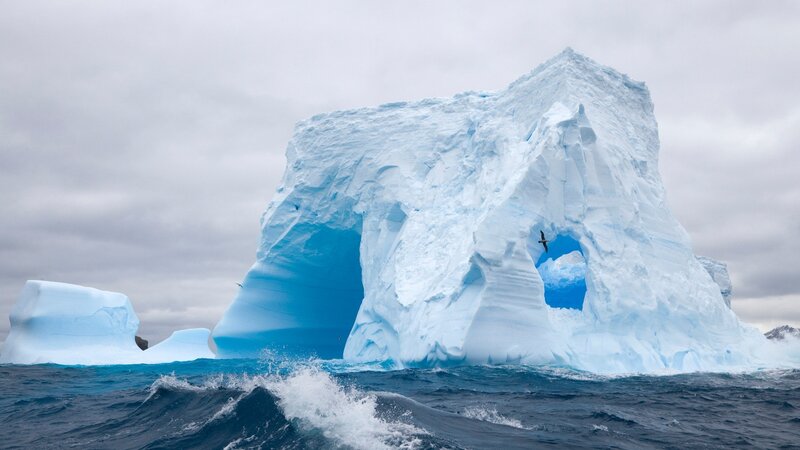 Large Iceberg in Ocean — Blue, Dramatic, Photograph