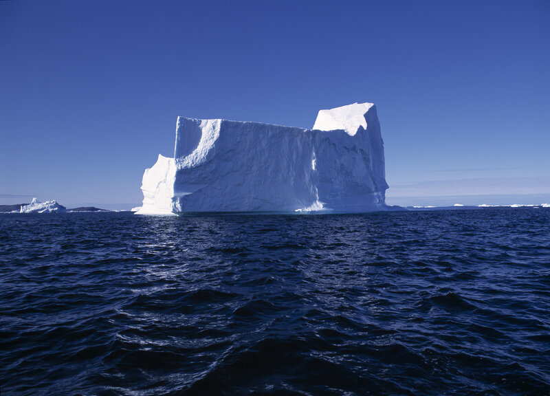 Large Iceberg in Ocean — Blue, Serene, Afternoon, Photograph, Sky, White