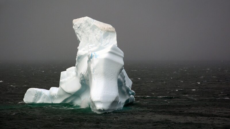 Large Iceberg in Ocean — White, Dramatic, Photograph