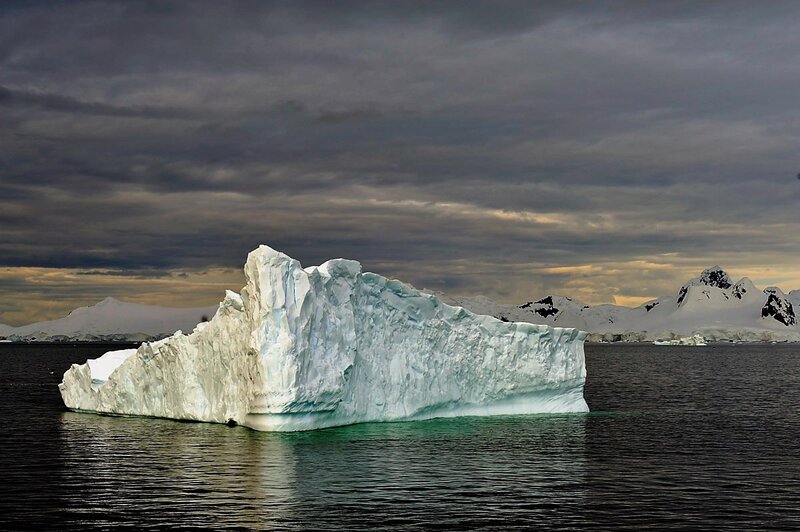 Large Iceberg in Water — White, Dramatic, Sunset, Photograph