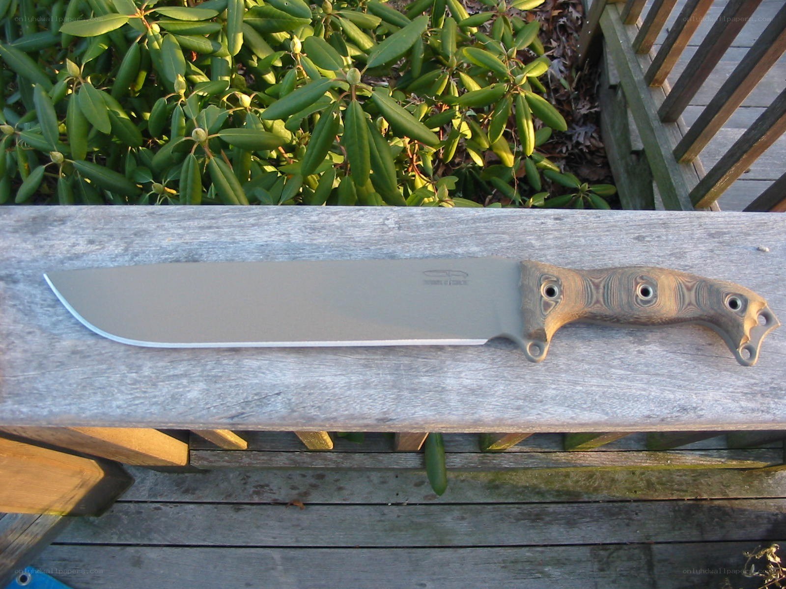 large knife on wooden surface
