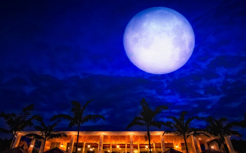 Large Moon over Building