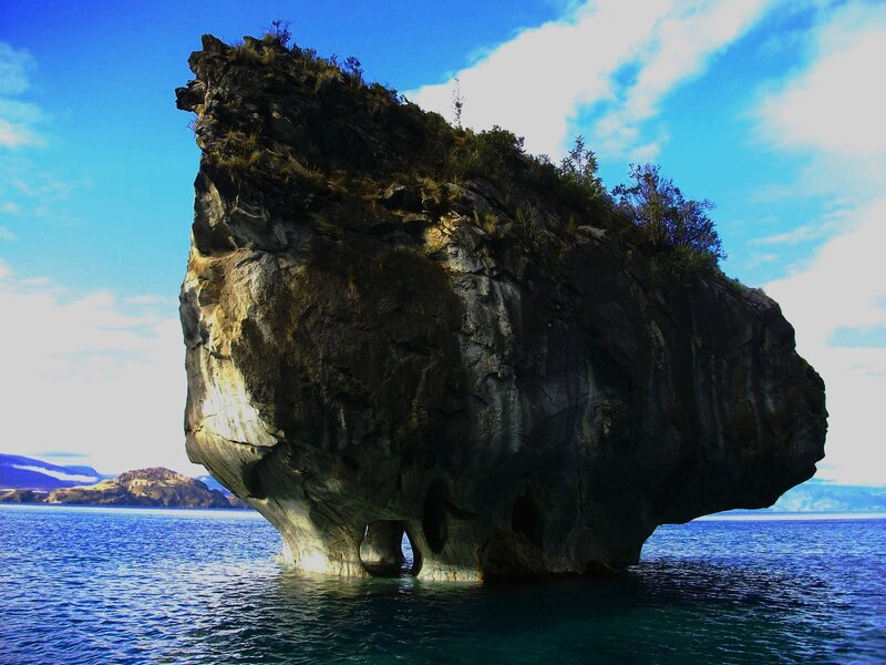 Large Rock Formation — Blue, Dramatic, Afternoon, Photograph, Sea
