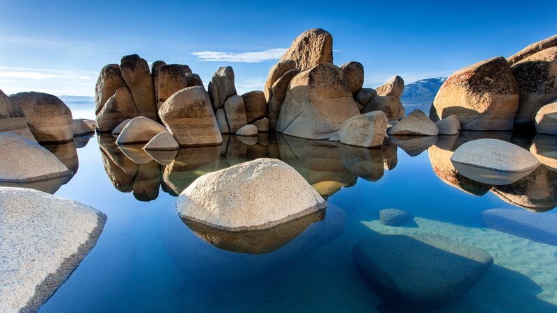 Large Rocks in Lake — Blue, Serene, Afternoon, Photograph, Sky, Mountains