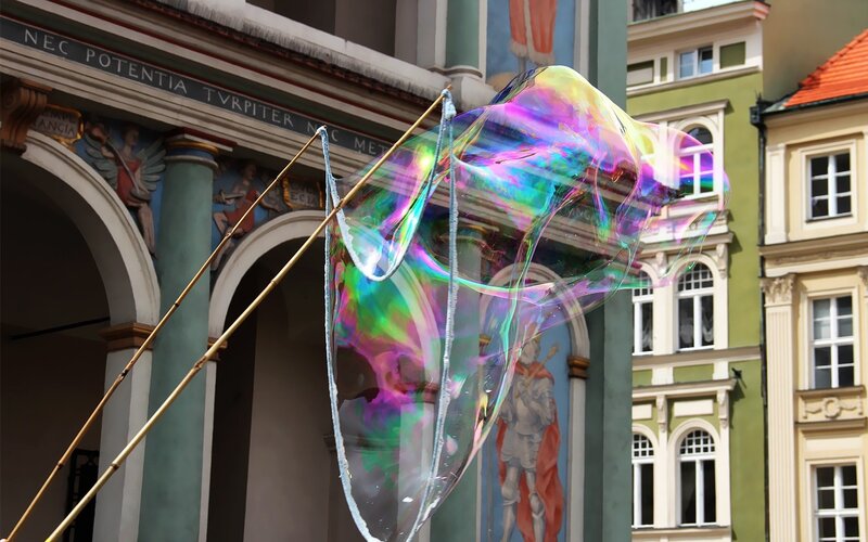 Large soap bubble in city square