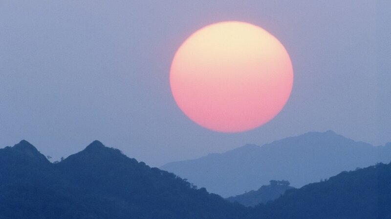 Large Sun over Mountains