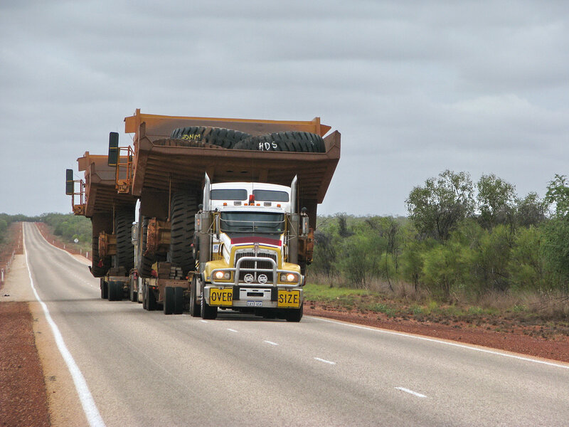 Large truck carrying mining equipment