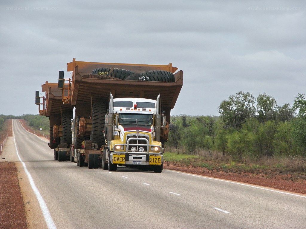 Large truck carrying mining equipment
