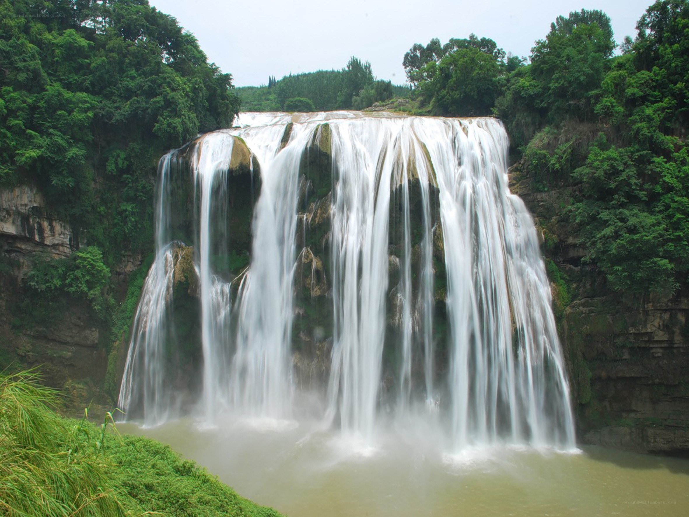 large waterfall in forest