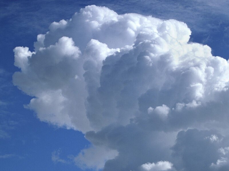 Large white cloud in blue sky