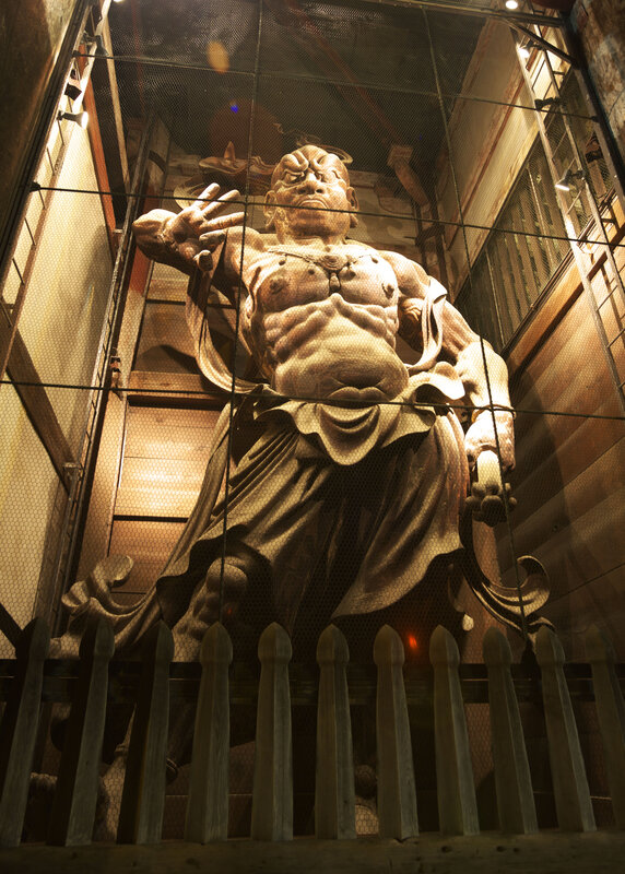 Large wooden statue in a temple
