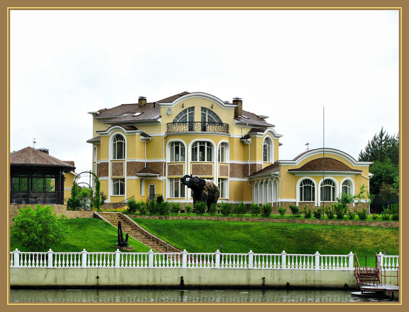Large yellow house by the water