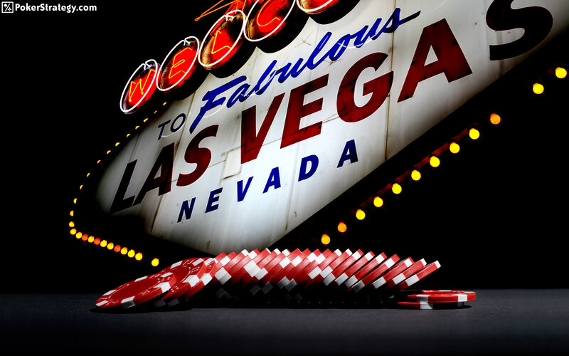 Las Vegas welcome sign with poker chips