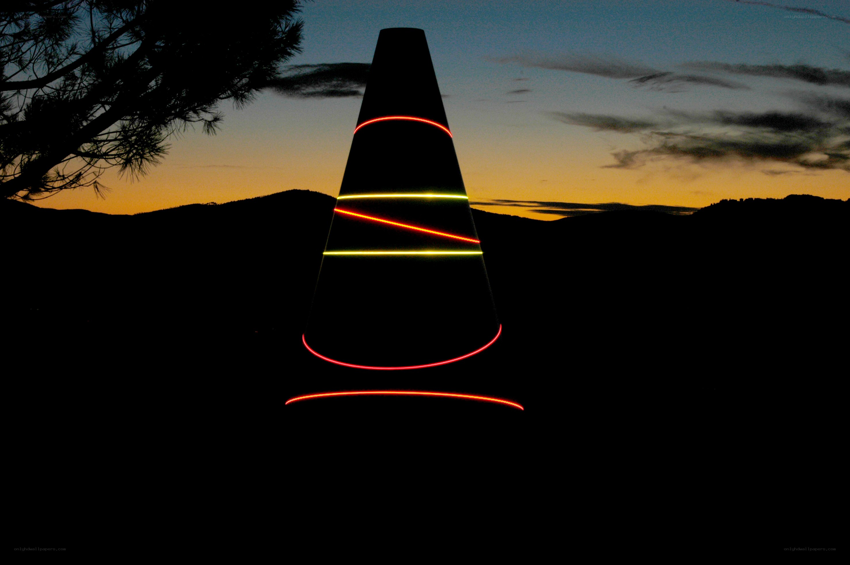 Laser art cone at dusk