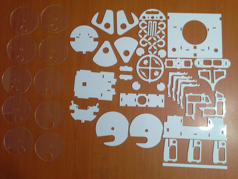 Laser-cut model parts on wood