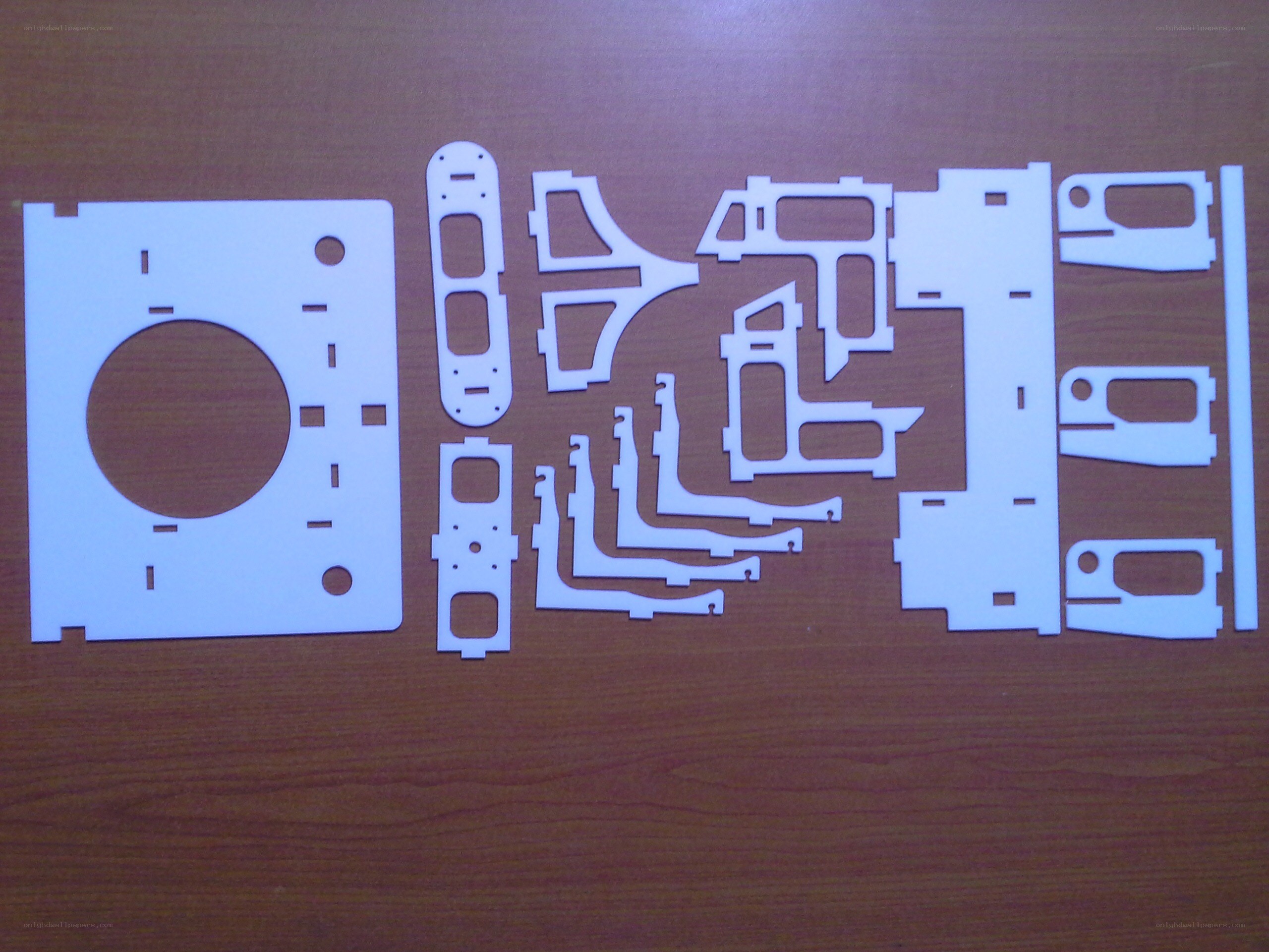 laser-cut parts on wood