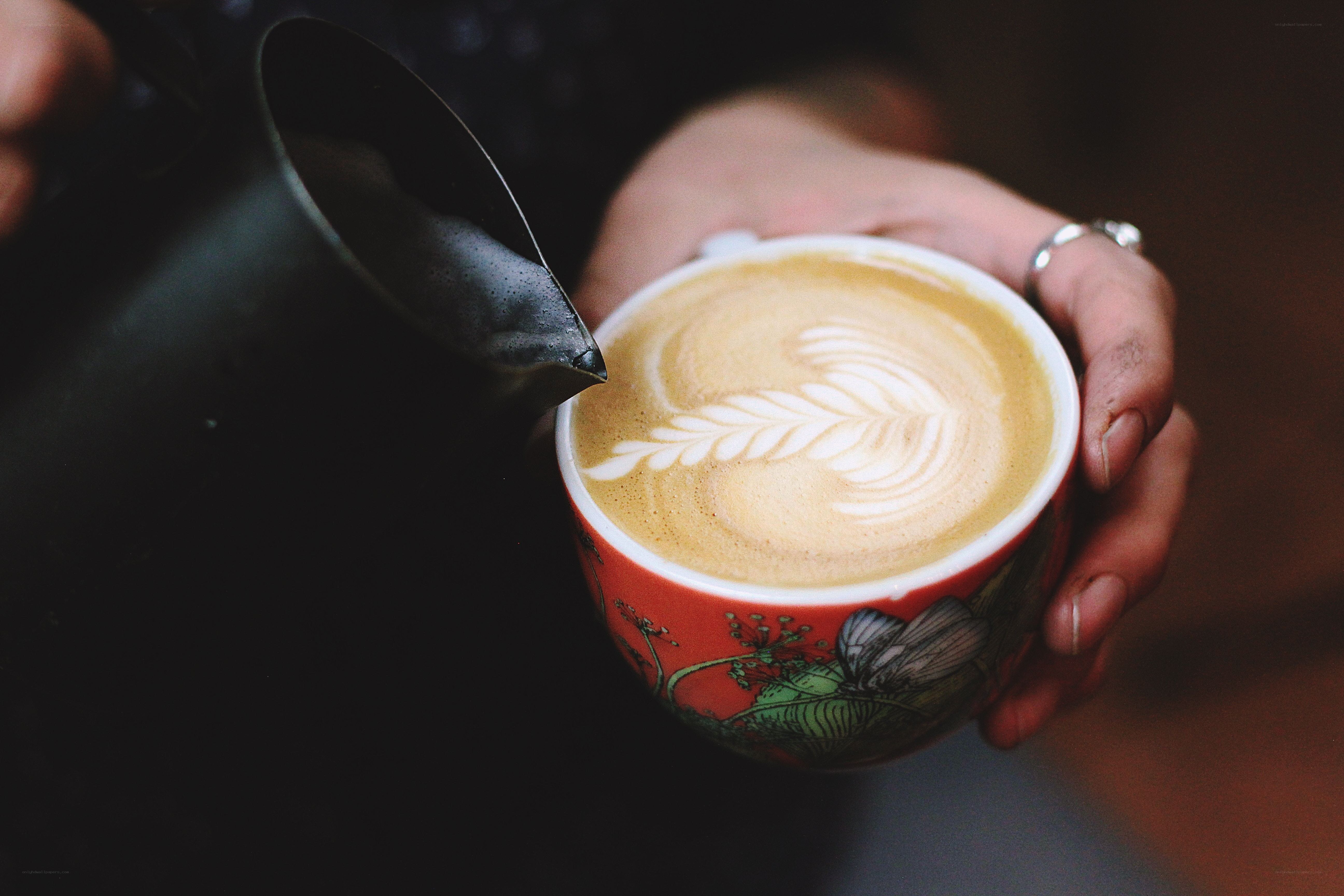 Latte art being poured