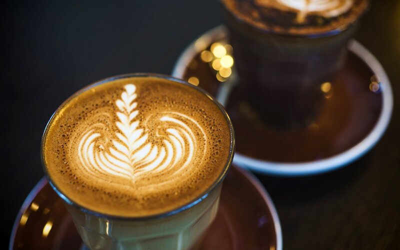 Latte Art in Coffee Cups — Brown